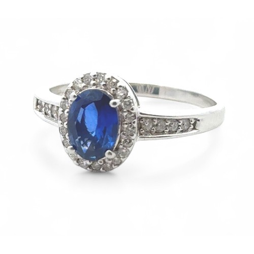 3 - An 18ct white gold and sapphire stone and diamond cluster ring with diamond shoulders, QVC hallmarks... 