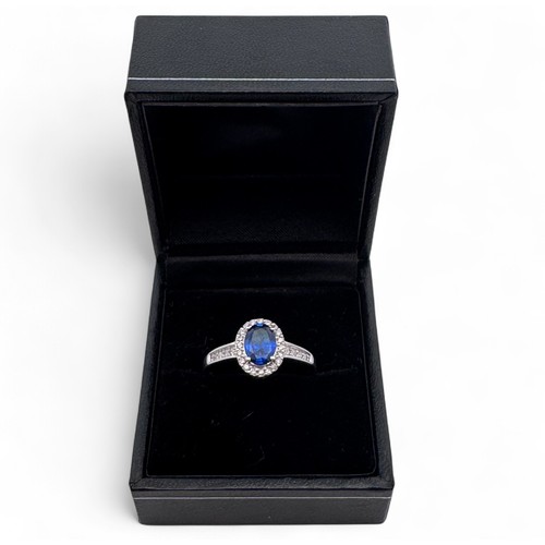 3 - An 18ct white gold and sapphire stone and diamond cluster ring with diamond shoulders, QVC hallmarks... 