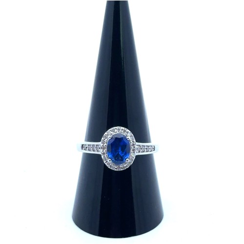 3 - An 18ct white gold and sapphire stone and diamond cluster ring with diamond shoulders, QVC hallmarks... 