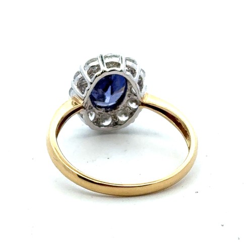 43 - A 14ct yellow gold and oval blue and white CZ cluster ring, QVC hallmarks. Size Q. 3.31g