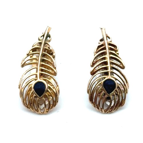 44 - Pair of 'peacock feather' 9ct gold clip on earrings. The back of one is in yellow gold, the other in... 