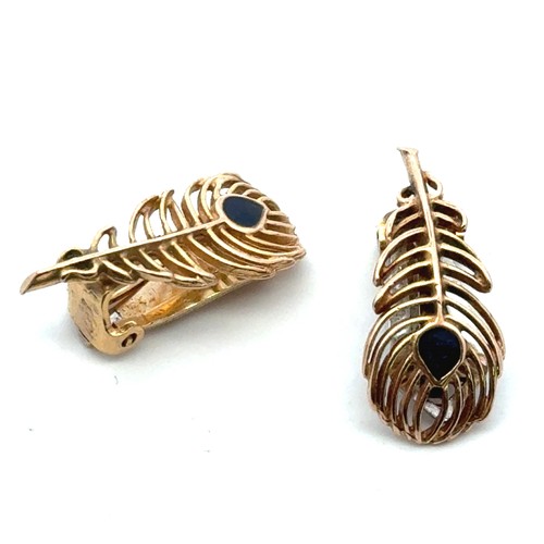 44 - Pair of 'peacock feather' 9ct gold clip on earrings. The back of one is in yellow gold, the other in... 