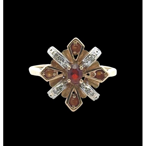 21 - A garnet, citrine and diamond ring in 14ct yellow gold. Size N.