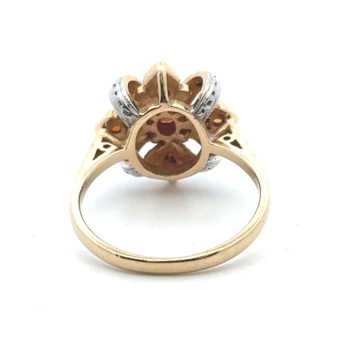 21 - A garnet, citrine and diamond ring in 14ct yellow gold. Size N.