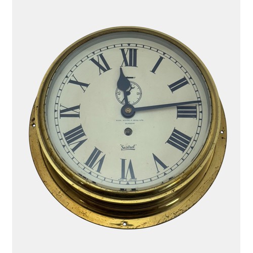 A Sestrel brass bulk head ships wall clock, inscribed Robb, Moore ...