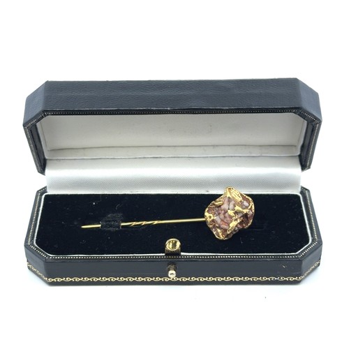 33 - A gold on matrix tie pin, 66mm in length. Pin gold plated. Boxed. 8.46g