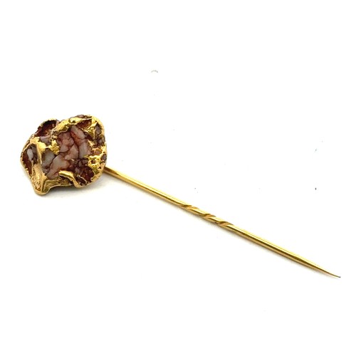 33 - A gold on matrix tie pin, 66mm in length. Pin gold plated. Boxed. 8.46g