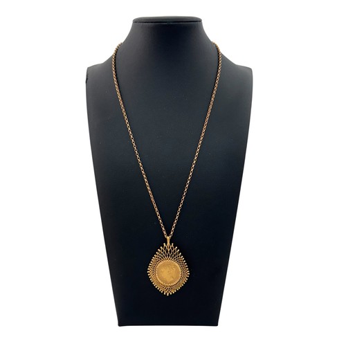 31 - A 1874 sovereign mounted as a pendant necklace in 9ct gold,  on a chain stamped 9ct.