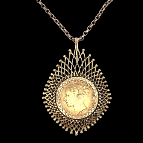 31 - A 1874 sovereign mounted as a pendant necklace in 9ct gold,  on a chain stamped 9ct.