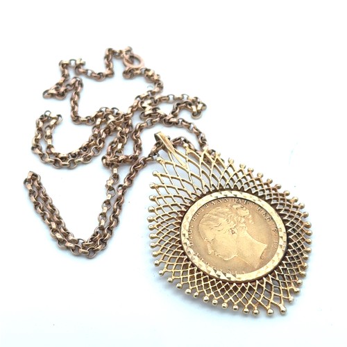 31 - A 1874 sovereign mounted as a pendant necklace in 9ct gold,  on a chain stamped 9ct.