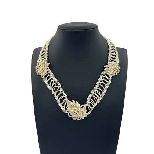 8 - A Georgian seed pearl necklace. Yellow metal with seed pearls surrounding a glazed hairwork panel. C... 