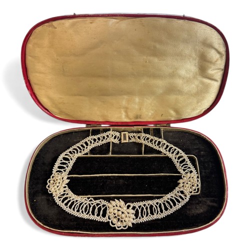 8 - A Georgian seed pearl necklace. Yellow metal with seed pearls surrounding a glazed hairwork panel. C... 