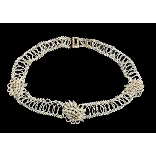 8 - A Georgian seed pearl necklace. Yellow metal with seed pearls surrounding a glazed hairwork panel. C... 
