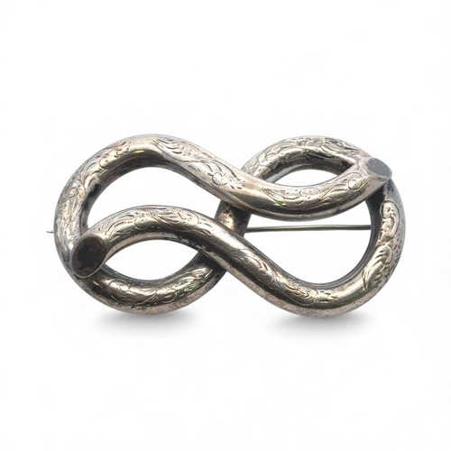 17 - A Victorian silver knot brooch, 61mm in length. Unmarked, tested as silver. 20.85g