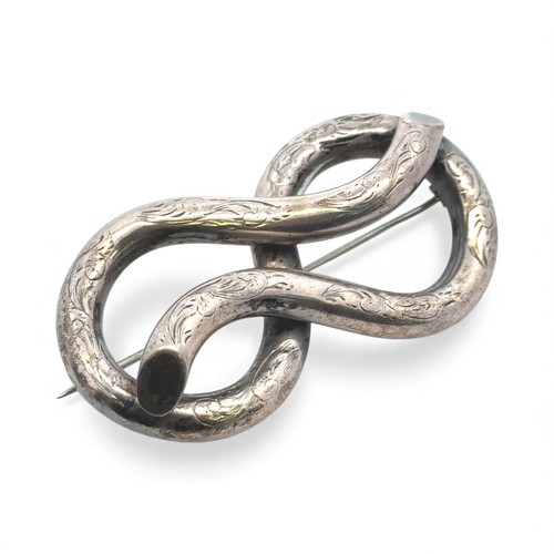 17 - A Victorian silver knot brooch, 61mm in length. Unmarked, tested as silver. 20.85g