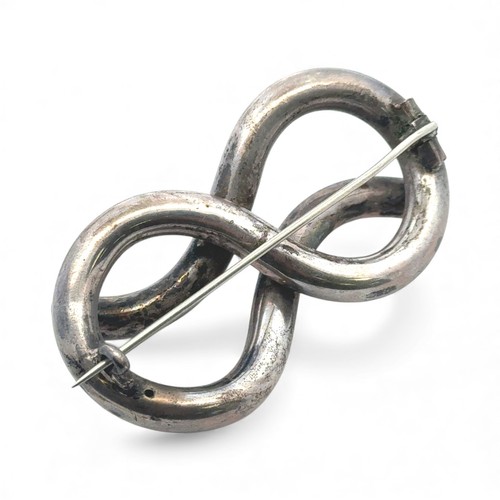 17 - A Victorian silver knot brooch, 61mm in length. Unmarked, tested as silver. 20.85g