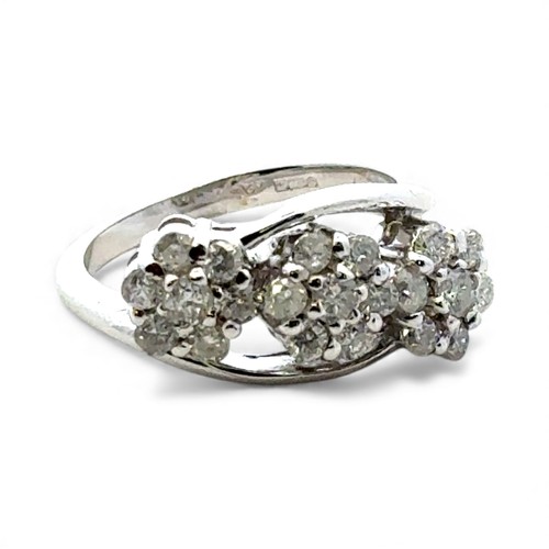 59 - An 18ct white gold diamond cluster ring in the form of three flower heads, size N.