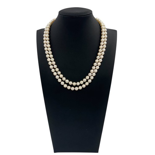 30 - A double strand uniform cultured pearl necklace with an 18ct yellow gold and diamond clasp. Can be d... 