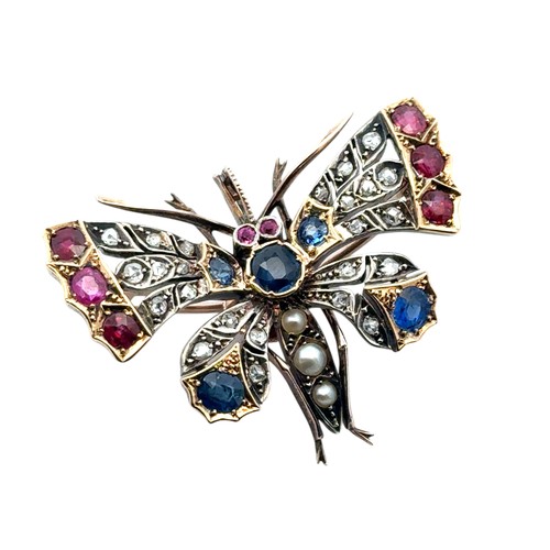 10 - A Victorian butterfly brooch / pendant in gold and silver, adorned with rose cut diamonds, rubies, s... 