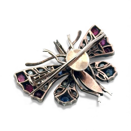 10 - A Victorian butterfly brooch / pendant in gold and silver, adorned with rose cut diamonds, rubies, s... 