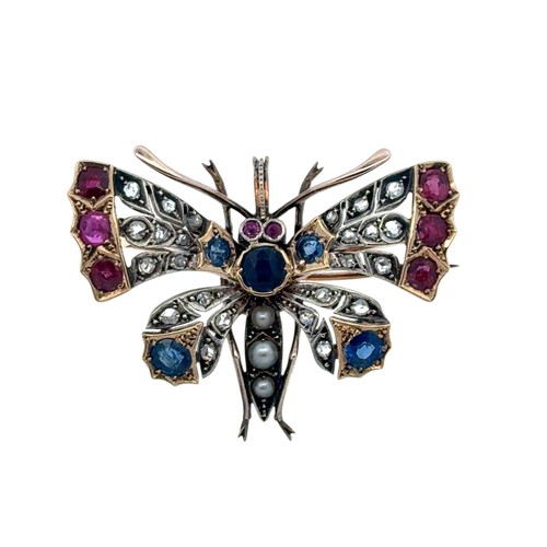 10 - A Victorian butterfly brooch / pendant in gold and silver, adorned with rose cut diamonds, rubies, s... 