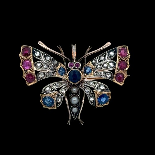 10 - A Victorian butterfly brooch / pendant in gold and silver, adorned with rose cut diamonds, rubies, s... 