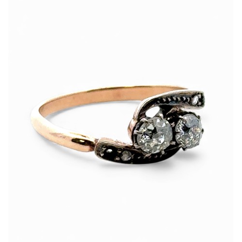 28 - Old cut diamond twist ring, stamped 18ct.  Missing a diamond on each shoulder. Size N.