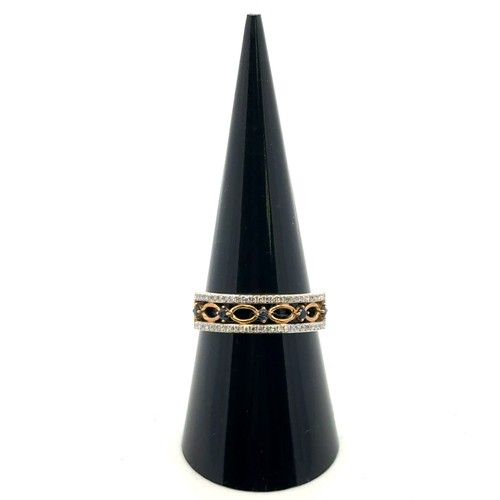 53 - A 9ct gold, sapphire and diamond ring, with five sapphires set between two rows of miligrain set dia... 