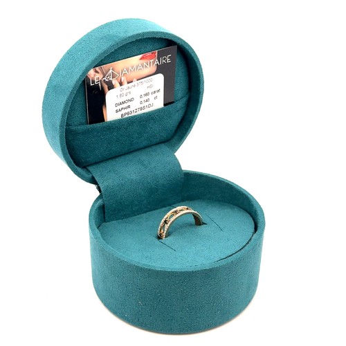 53 - A 9ct gold, sapphire and diamond ring, with five sapphires set between two rows of miligrain set dia... 