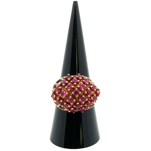 1 - A 1970s 9ct gold ruby bombe ring, size P. Birmingham 1972. 6.68g