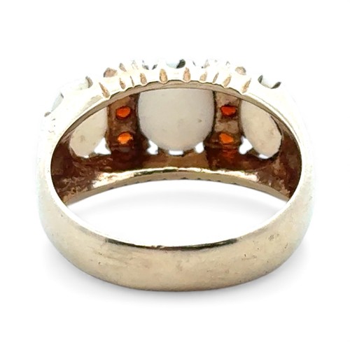 25 - A 9ct gold, opal and garnet ring, size O.