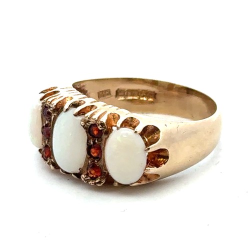 25 - A 9ct gold, opal and garnet ring, size O.