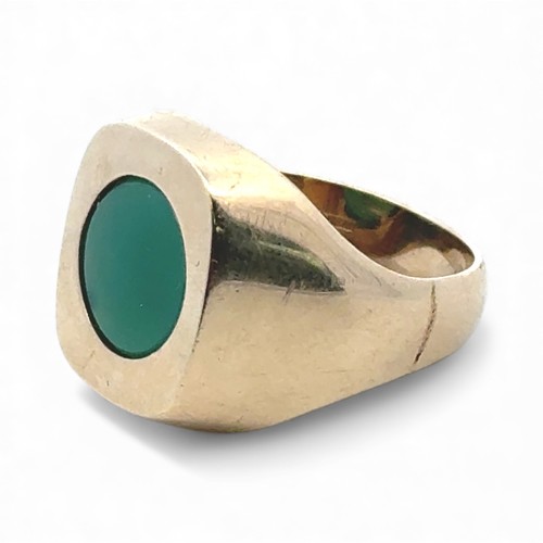 45 - A 9ct gold signet ring set with a circular chrysoprase, size U. Ring head 18mm x 16mm.