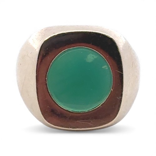45 - A 9ct gold signet ring set with a circular chrysoprase, size U. Ring head 18mm x 16mm.