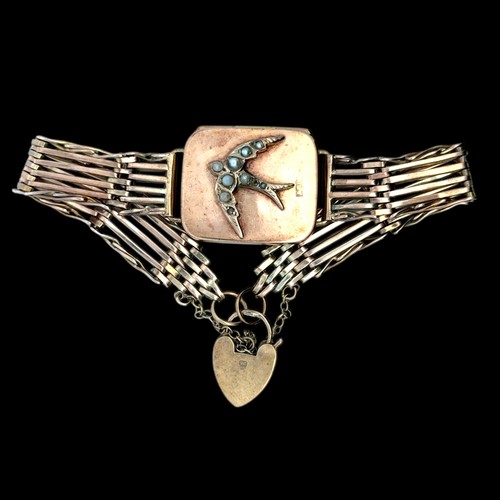 22 - A gold gate link bracelet locket set with seed pearls,  the locket 25mm x 21mm.
18.39g
