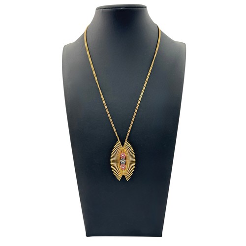 56 - An 18ct gold brooch/pendant necklace set with three ruby and sapphire 'flowers' with diamond centres... 