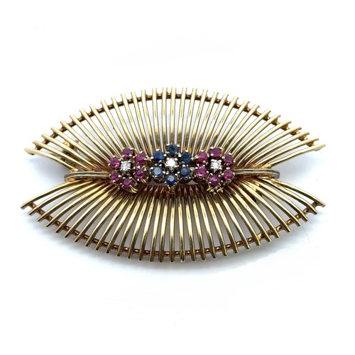 56 - An 18ct gold brooch/pendant necklace set with three ruby and sapphire 'flowers' with diamond centres... 