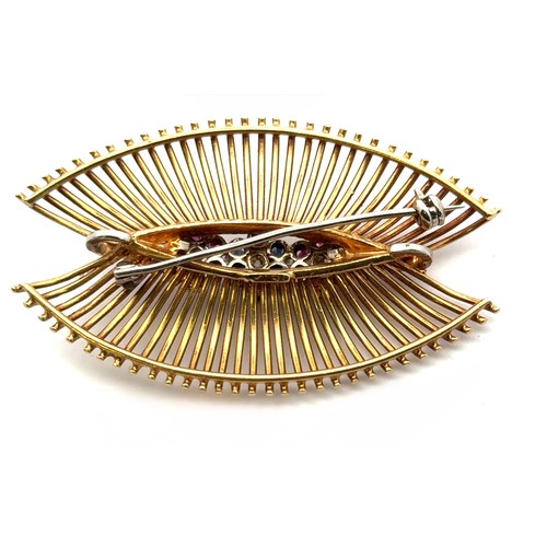 56 - An 18ct gold brooch/pendant necklace set with three ruby and sapphire 'flowers' with diamond centres... 