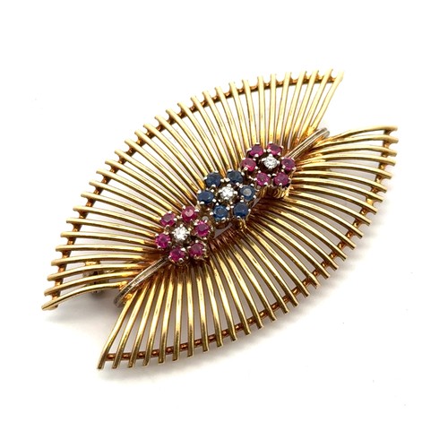 56 - An 18ct gold brooch/pendant necklace set with three ruby and sapphire 'flowers' with diamond centres... 
