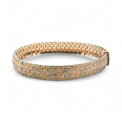 2 - A tri-coloured and engraved gold bracelet stamped 750. Length 19cm.