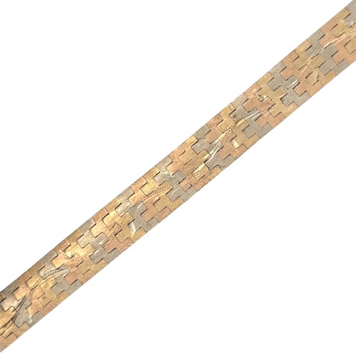 2 - A tri-coloured and engraved gold bracelet stamped 750. Length 19cm.