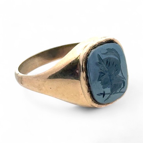 4 - A haematite centurion intaglio signet ring in 9ct yellow gold, size U.