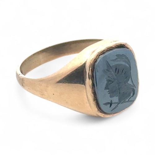 4 - A haematite centurion intaglio signet ring in 9ct yellow gold, size U.