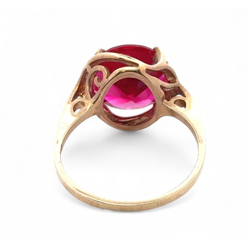 36 - A synthetic ruby dress ring stamped 9k, size Q/R.