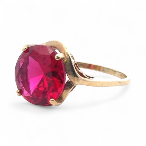 36 - A synthetic ruby dress ring stamped 9k, size Q/R.