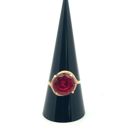 36 - A synthetic ruby dress ring stamped 9k, size Q/R.
