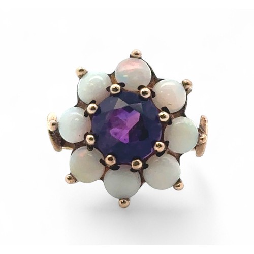 6 - An amethyst and opal stone cluster ring, stamped 9ct gold, size M.