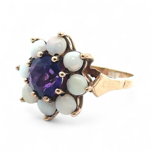 6 - An amethyst and opal stone cluster ring, stamped 9ct gold, size M.
