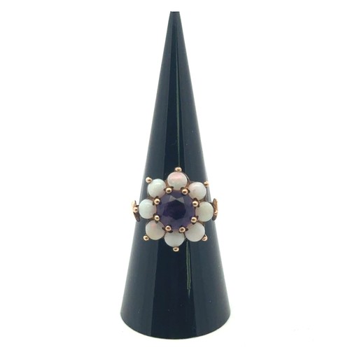 6 - An amethyst and opal stone cluster ring, stamped 9ct gold, size M.