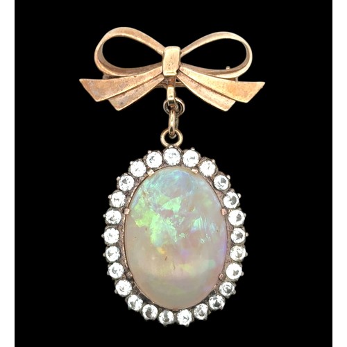 19 - An opal and white stone bow brooch. Opal approx 25mm x 18mm. Bow with Birmingham hallmarks. Length 5... 